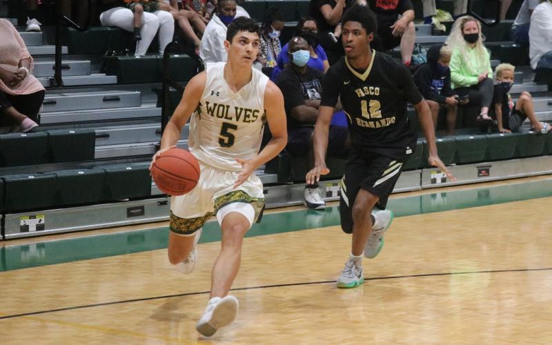FGC guard Caleb Hayden dribbles in to take a shot against Pasco-Hernando State College during Saturday's FCSAA Region 8 Division II Championship at the Howard Center. (JORDAN KROEGER/Lake City Reporter)