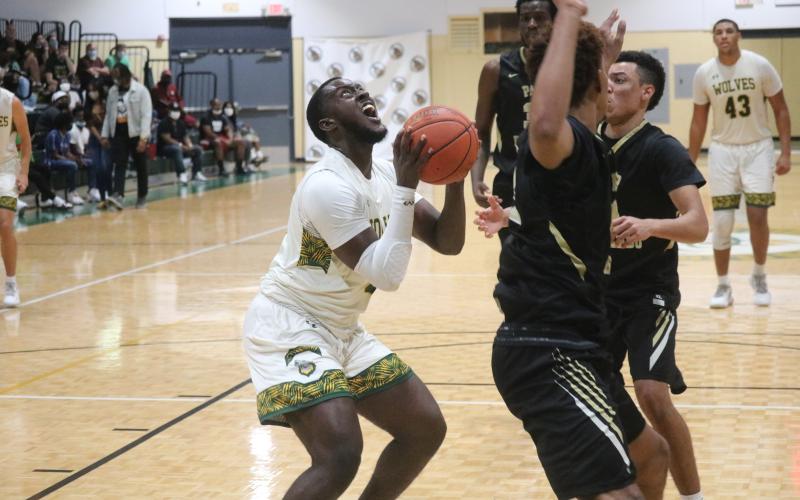 FGC forward Doug McCalla goes up for a shot against Pasco-Hernando State College during Saturday's FCSAA Region 8 Division II Championship at the Howard Center. (JORDAN KROEGER/Lake City Reporter)