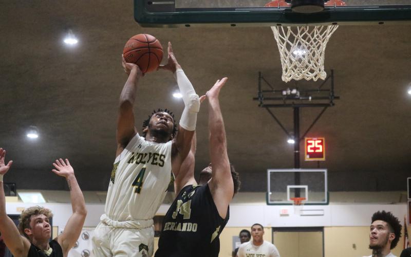 FGC guard Antonio Card rises for a shot against Pasco-Hernando State College during Saturday's FCSAA Region 8 Division II Championship at the Howard Center. (JORDAN KROEGER/Lake City Reporter)