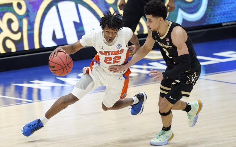Florida's Tyree Appleby (22) drives against Vanderbilt's Scotty Pippen Jr. (2) during the SEC Tournament on Thursday in Nashville, Tenn. (MARK HUMPHREY/Associated Press)
