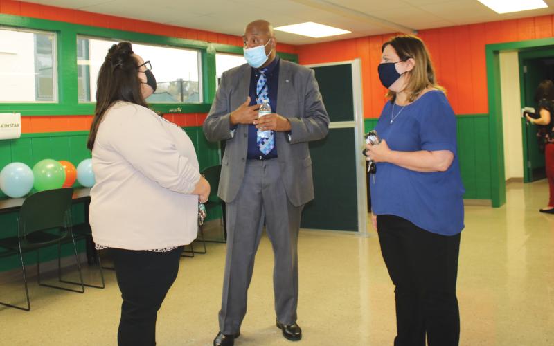 NorthStar Family Resource Center manager Philip Mobley (center) gives a tour of the facilities at the Richardson Community Center.