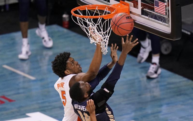 Oral Roberts forward DeShang Weaver (14) shoots ahead of Florida forward Omar Payne (5) during the second round of the NCAA Tournament at Indiana Farmers Coliseum on March 21 in Indianapolis. (AJ MAST/Associated Press)