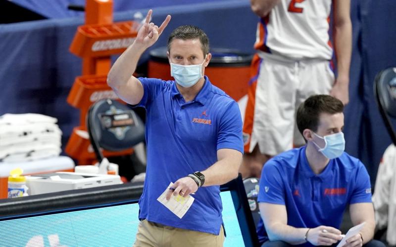 Florida head coach Mike White directs his players against Vanderbilt in the SEC Tournament on Thursday in Nashville, Tenn. (MARK HUMPHREY/Associated Press)