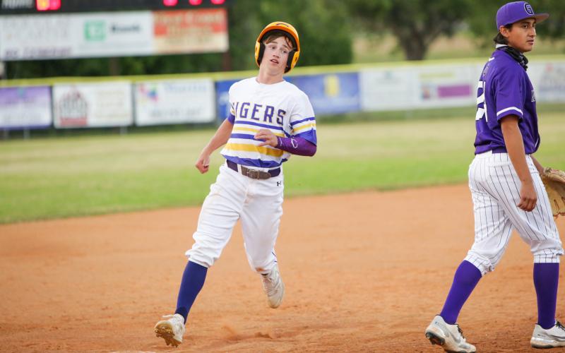 Columbia pitcher Matthew Dumas walks off the field after getting stranded at second base in the third inning of Tuesday’s game against Gainesville. (BRENT KUYKENDALL/Lake City Reporter)
