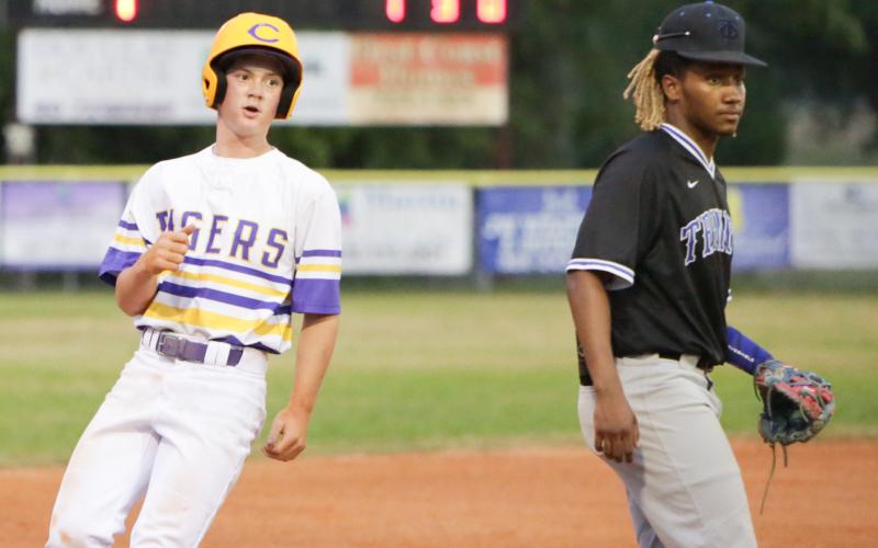 Columbia outfielder Branson Mann advances to third base on a passed ball against Trinity Christian on Friday night. (BRENT KUYKENDALL/Lake City Reporter)