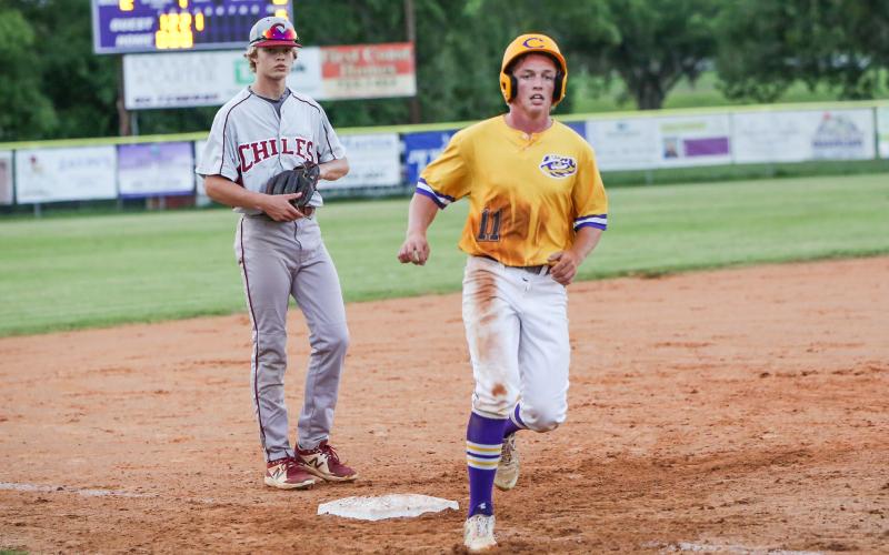 Columbia first baseman Ty Wehinger takes a lead off of third base against Chiles on Tuesday night. (BRENT KUYKENDALL/Lake City Reporter)
