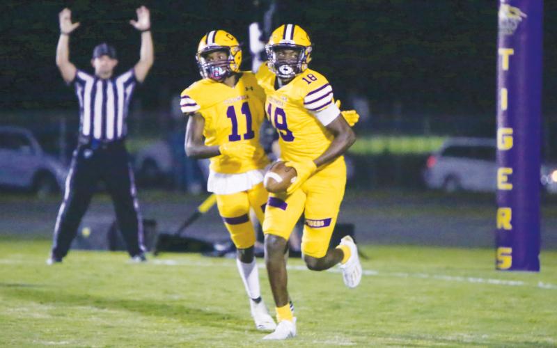 Columbia receiver Jaquez Redic runs up the field after a making catch against Wakulla last season. (BRENT KUYKENDALL/Lake City Reporter)