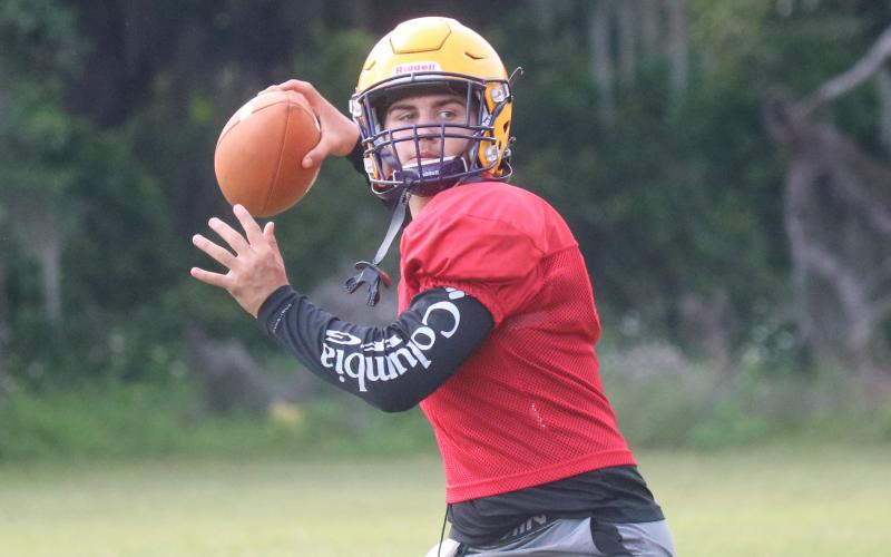 Columbia quarterback Cohen David throws a pass during Friday's practice. (JORDAN KROEGER/Lake City Reporter)