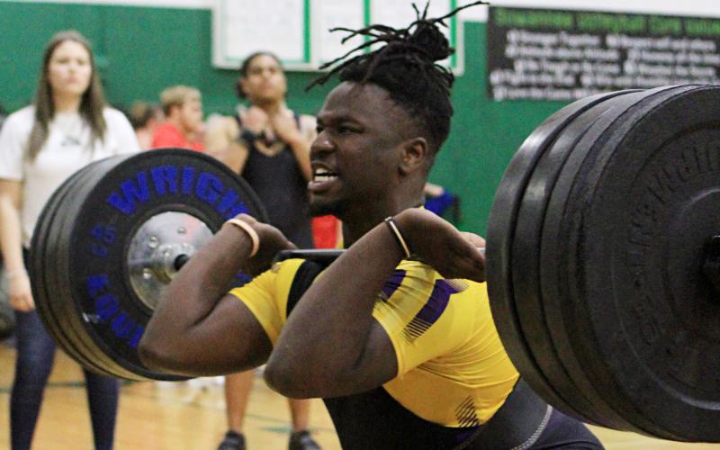 Columbia’s Tyler Ford performs the clean and jerk during the Region 1-2A meet on Friday. Ford placed fourth in the 238 weight class, earning an at-large bid to the Class 2A state meet on Tuesday. (PAUL BUCHANAN/Special to the Reporter)