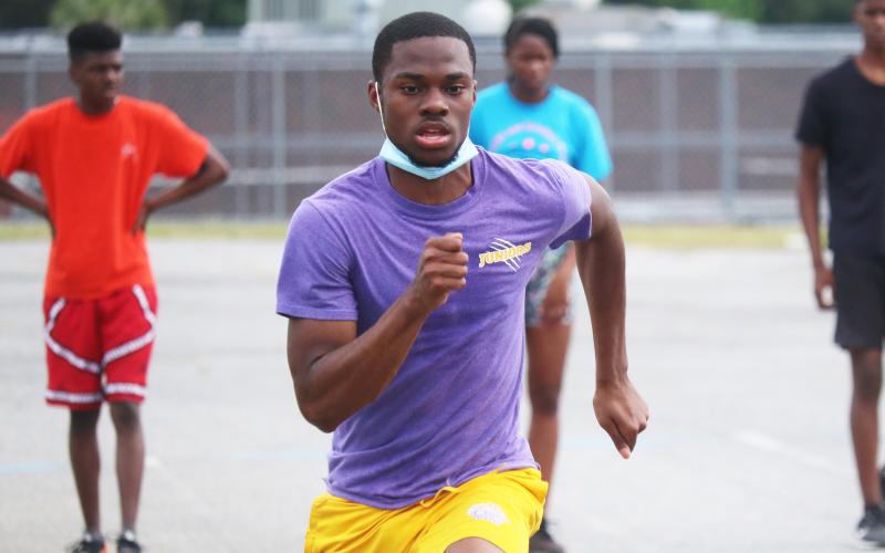 Columbia’s James Williamson runs during Thursday’s practice. Williamson broke the school records in the 100m and 200m at Santa Fe's Last Chance Meet on Wednesday. (JORDAN KROEGER/Lake City Reporter)