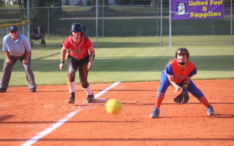 Fort White pitcher Hannah LeBleu takes a lead off of third base as a pitch flies by during Tuesday night’s District 6-1A semifinal against Taylor County. (JORDAN KROEGER/Lake City Reporter)