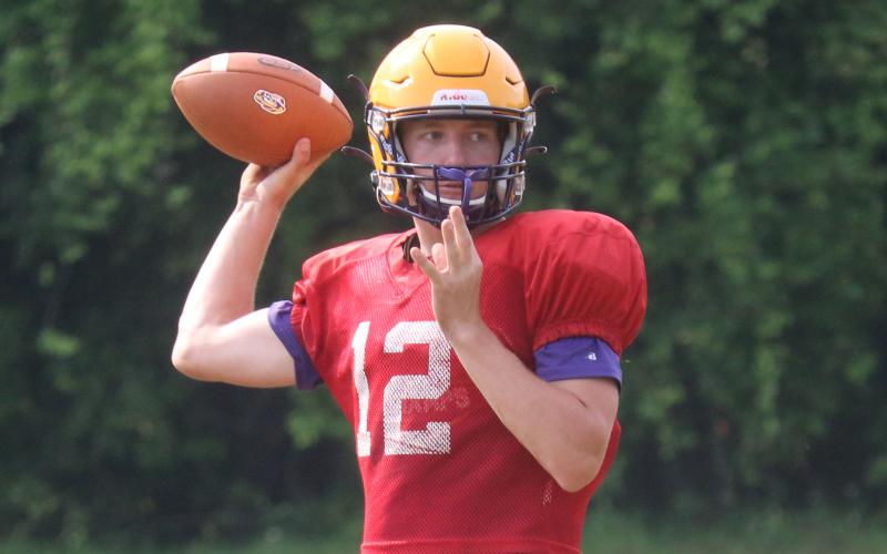 Columbia quarterback Kade Jackson throws a pass during Friday's practice. (JORDAN KROEGER/Lake City Reporter)