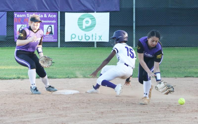 Columbia second baseman Sofia Arata can’t hold onto a throw as Gainesville’s Jayla Clark slides safely into second base. (MORGAN MCMULLEN/Lake City Reporter)