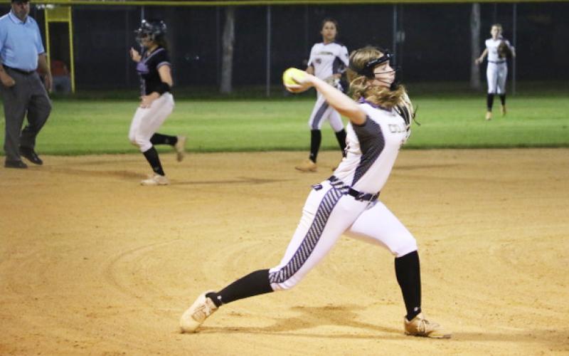 Columbia pitcher Emma Edson fires to first base for an out against Gainesville during the District 3-5A semifinals on Tuesday night. (MORGAN MCMULLEN/Lake City Reporter)