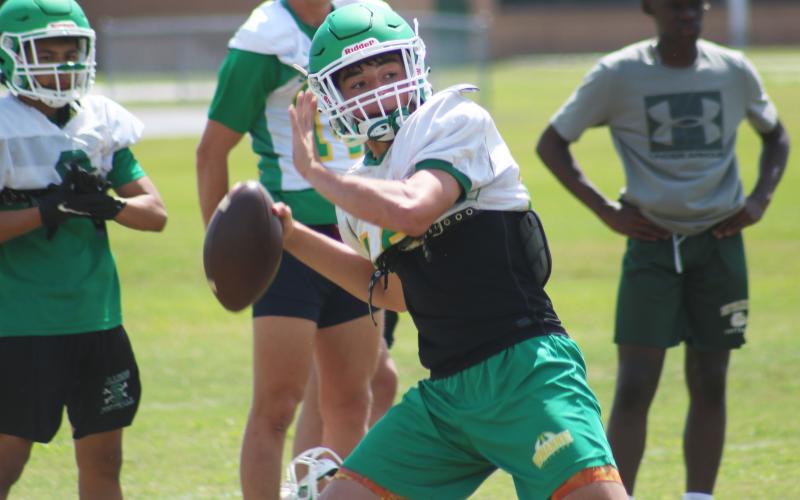 Suwannee quarterback Kodi Lang throws a pass during Thursday’s practice. (JAMIE WACHTER/Lake City Reporter)