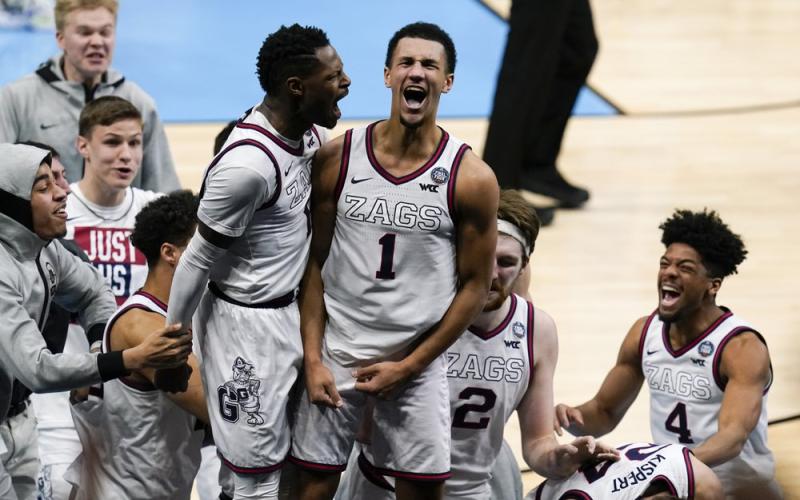 Gonzaga guard Jalen Suggs (1) celebrates making the game-winning basket with Joel Ayayi, left, against UCLA during overtime in the Final Four semifinal game at Lucas Oil Stadium on Saturday in Indianapolis. Gonzaga won 93-90. (MICHAEL CONROY/Associated Press)