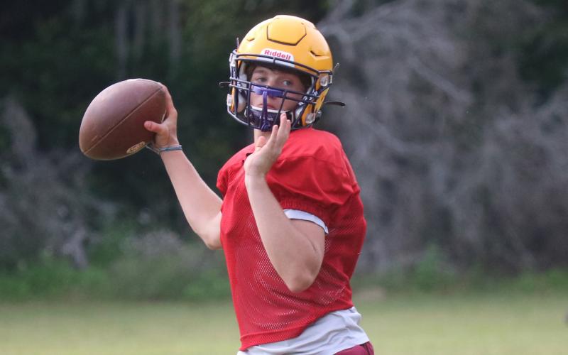 Columbia quarterback Evan Umstead throws a pass during Friday's practice. (JORDAN KROEGER/Lake City Reporter)