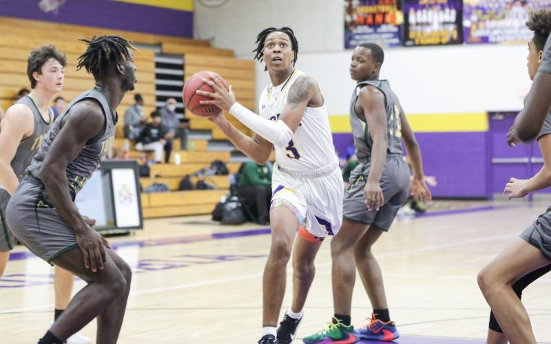 Columbia forward Charleston Ponds drives to the basket against Trinity Catholic this past season. (BRENT KUYKENDALL/Lake City Reporter)