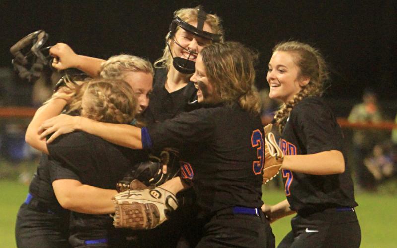 Branford’s softball team celebrates after defeating Hilliard 6-1 in the Region 3-1A semifinals on Thursday. It was the first playoff win in program history. (PAUL BUCHANAN/Special to the Reporter)