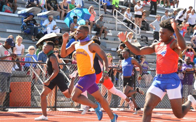 Columbia sprinter James Williamson (middle) qualified for the Class 3A state meet in the 100m, 200m and 400m. (OSMUND JOHNSON/Special to the Reporter)