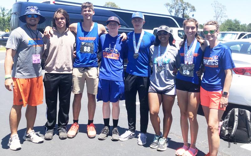 Branford’s coaches and athletes at the Class 1A state meet on Friday at the University of North Florida’s Hodges Stadium. Pictured are boys coach Tim Clark (from left), Justin Hernandez, Evan Dowdy, Bruce Criggall, Seth Humphries, Zamaria Granado, Nathalia Veal and girls coach Erin Clark. (COURTESY)