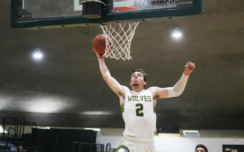 FGC forward Layton Veon rises on a fast break for a dunk against Pasco-Hernando State during the Region 8 championship game on March 27. Veon committed to Coastal Georgia on Thursday after finishing up his two years with the Timberwolves. (JORDAN KROEGER/Lake City Reporter)