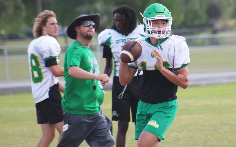 Suwannee quarterback Kodi Lang sets to pass during practice on April 29. (JAMIE WACHTER/Lake City Reporter)