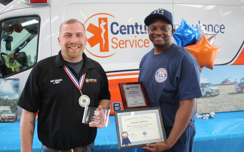 Aaron Smith (left), a Century Ambulance shift manager, was recognized as the agency’s Star of Life Award recipient which recognizes the team member whose contributions as an ambulance professional has gone above the call of duty in service to their communities. Smith stands with Jovante Johnson who was honored as the EMT employee of the quarter. Amanda Slater, who was awarded the paramedic employee of the quarter, was unavailable for the photograph. (TONY BRITT/Lake City Reporter)
