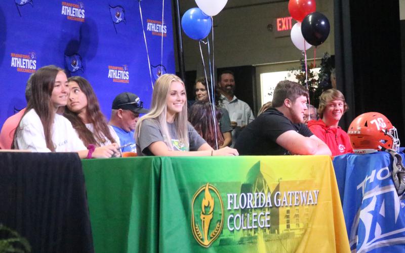 Branford twin sisters Kyla and Kayla Desmartin signed to run at Florida Gateway College on Thursday, while Blair Smith also signed with Florida Gateway College to play volleyball. Branford offensive lineman signed to play football at Thomas More University. Branford catcher Clay Williams signed to play baseball at Gardner-Webb. (JAMIE WACHTER/Lake City Reporter)