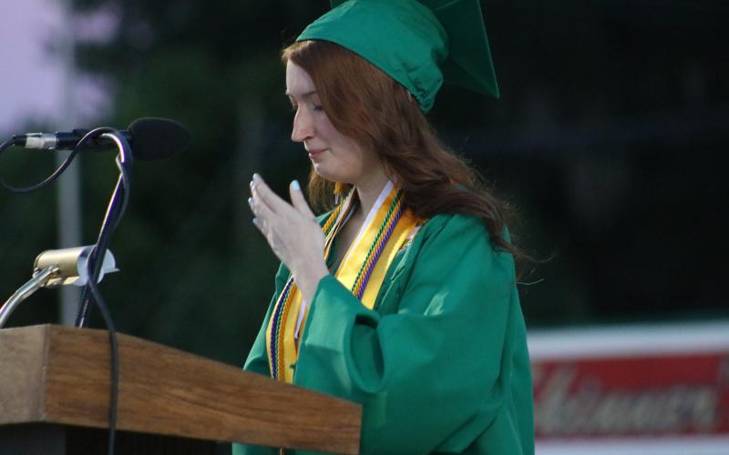 Valedictorian Eva Forehand chokes back tears during her graduation speech. (JAMIE WACHTER/Lake City Reporter)