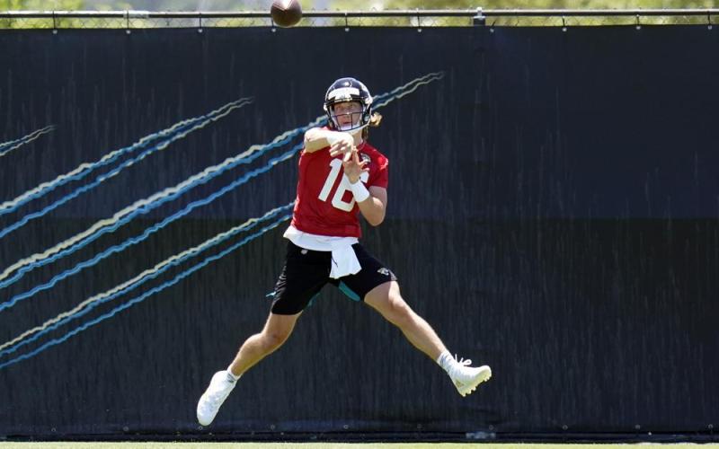 Jacksonville Jaguars quarterback Trevor Lawrence (16) throws a pass during rookie minicamp on Saturday in Jacksonville. (JOHN RAOUX/Associated Press)