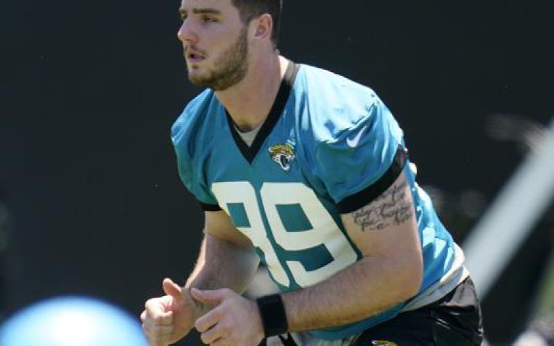 Jacksonville Jaguars tight end Luke Farrell performs a drill during rookie minicamp on Saturday in Jacksonville. (JOHN RAOUX/Associated Press)