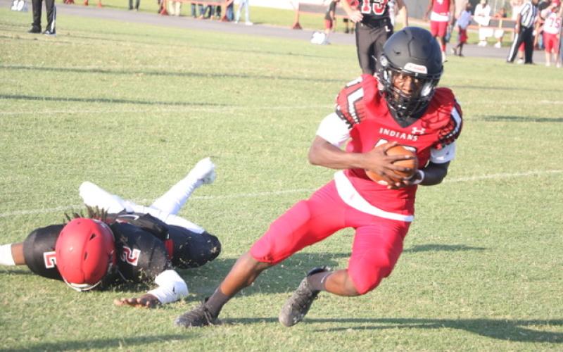 Fort White receiver Najeeb Smith breaks away for what he thought was a 50-yard touchdown during Thursday’s spring game against Lafayette. The score was called back for holding. (MORGAN MCMULLEN/Lake City Reporter)
