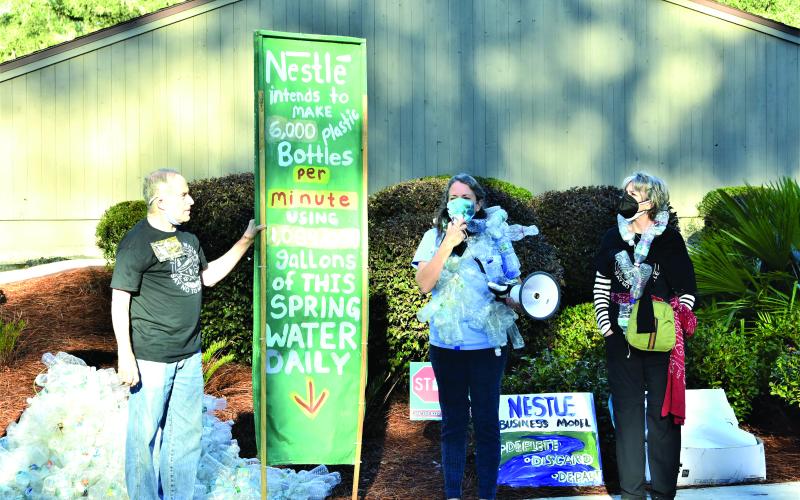 Our Santa Fe River members Michael Roth, from left, Merrillee Malwitz-Jipson and Kristin Rubin protest outside the Suwannee River Water Management District headquarters on the morning of February 23. (FILE)
