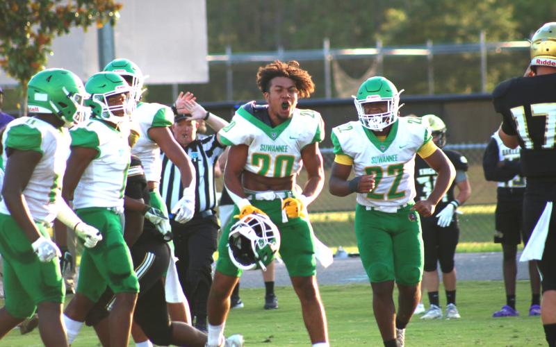 Travis McKinney celebrates after a goal line fourth down stop during Friday’s win over Oakleaf. (JAMIE WACHTER/Lake City Reporter)