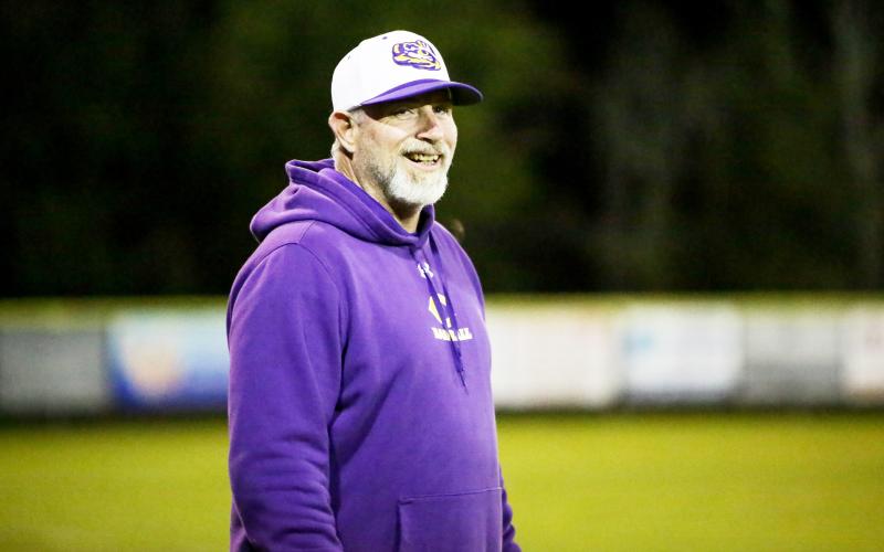 Columbia coach Brian Thomas cracks a smile during his team’s game against Bradford on March 3. (BRENT KUYKENDALL/Lake City Reporter)