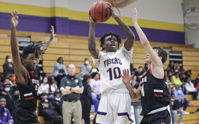 Columbia guard Isaac Broxey rises to shoot against Baker County last season. (BRENT KUYKENDALL/Lake City Reporter)
