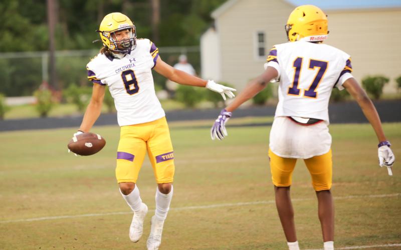 Columbia receiver Jace Hoskey (left) celebrates with Eddrin Thompson after catching a touchdown pass during Friday’s spring game against Bartram Trail. (BRENT KUYKENDALL/Lake City Reporter)
