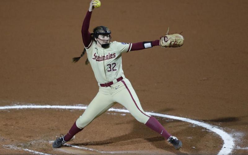 Florida State's Kathryn Sandercock (32) delivers a pitch to Oklahoma State in the first inning of Saturday’s Women’s College World Series game in Oklahoma City. (ALONZO ADAMS/Associated Press)