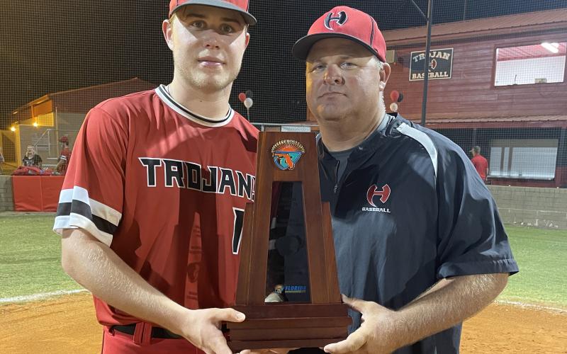 Chris Howard (right) is pictured with his son Brent Howard after Hamilton County won the District 6-1A title this past season. The Columbia County School Board approved Howard as Columbia’s new baseball coach on Tuesday after he agreed to take the job at the end of May. Brent will be joining him as a senior at Columbia as well. (FILE)