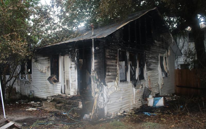 The remains of the house at 441 Northwest Madison Street after a fire destroyed much of the property in and surrounding the home. (COURTESY)