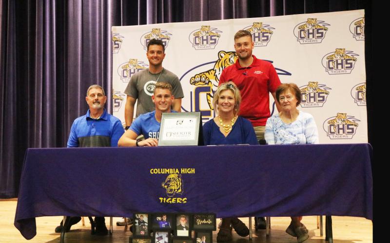 Columbia goalkeeper Colby Strickland (left center) signed his letter of intent to play at Shorter University on Wednesday in the high school auditorium. Strickland is pictured with his father, Sid (bottom left), his mother, Donna (center right), his grandmother Brenda Outlaw (bottom right), and his brothers Caleb (top left) and Jacob (top right). (JORDAN KROEGER/Lake City Reporter)