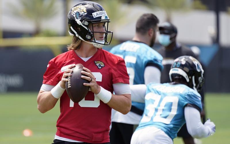 Jacksonville Jaguars quarterback Trevor Lawrence looks for a receiver during practice on Tuesday in Jacksonville. (JOHN RAOUX/Associated Press)