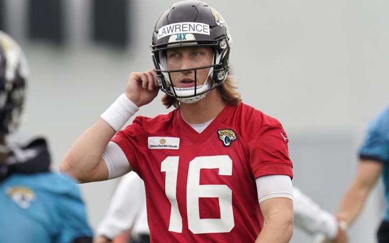 Jacksonville Jaguars quarterback Trevor Lawrence takes a break during practice Monday in Jacksonville. (JOHN RAOUX/Associated Press)