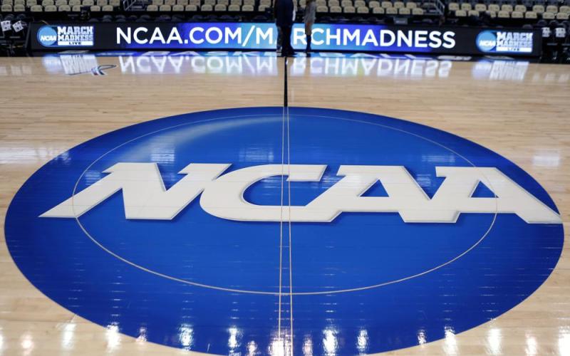 The NCAA logo is displayed as work continues at The Consol Energy Center for the NCAA Tournament on March 15, 2015, in Pittsburgh. The NCAA Board of Directors is expected to greenlight one of the biggest changes in the history of college athletics when it clears the way for athletes to start earning money based on their fame and celebrity without fear of endangering their eligibility or putting their school in jeopardy of violating amateurism rules that have stood for decades. (AP FILE PHOTO)