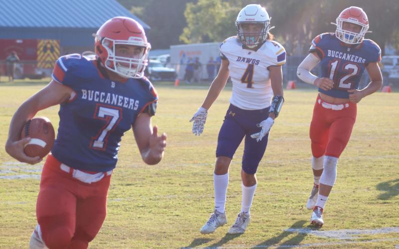 Branford running back Bodhi White bolts down the field for a touchdown against Bell in the teams’ spring game on May 24. (JAMIE WACHTER/Lake City Reporter)