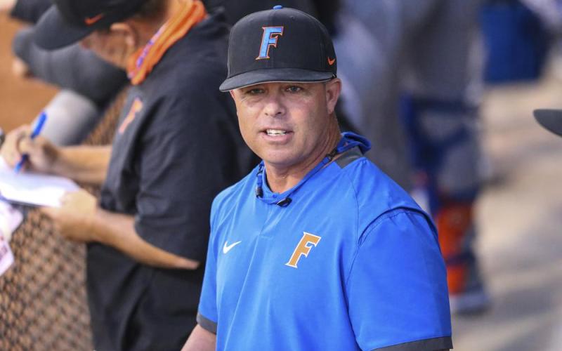 Florida head coach Kevin O'Sullivan watches from the dugout during a game against North Florida in on Feb. 23 in Jacksonville. (AP FILE PHOTO)