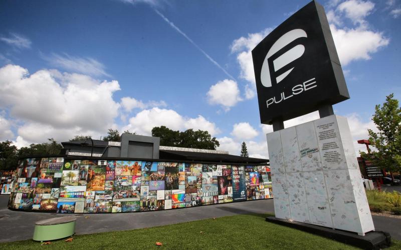 Photos and keepsakes adorn the Pulse Interim Memorial located at the Pulse nightclub site south of downtown Orlando, Thursday, June 6, 2019. June 12 marked the fifth anniversary of the mass shooting that left 49 club patrons dead. (JOE BURBANK/Orlando Sentinel/TNS)