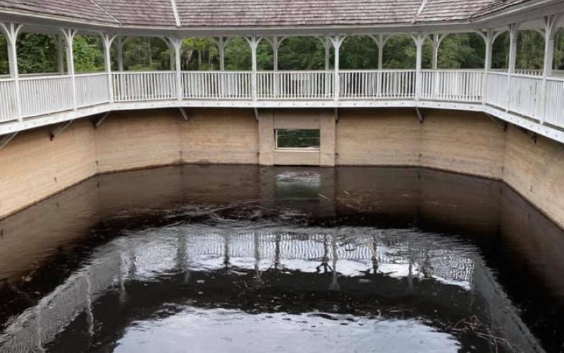 The rising Suwannee River nears the top of the bath house in White Springs. (COURTESY)