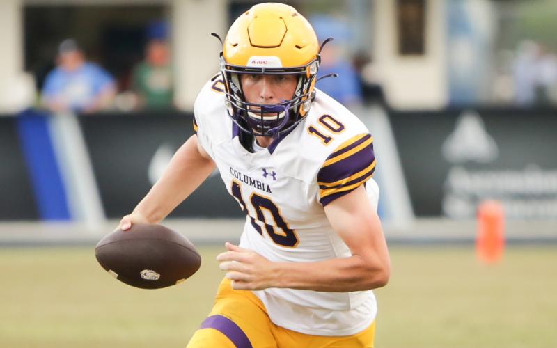 Columbia quarterback Kade Jackson scrambles up the field for yardage against Bartram Trail during the teams’ spring game on May 28. (BRENT KUYKENDALL/Lake City Reporter)